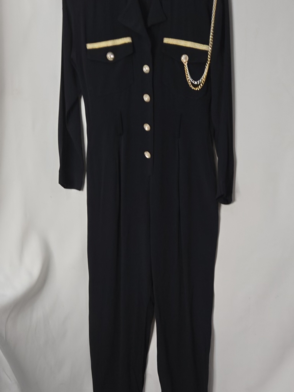 Statement Military Chic black jumpsuit with gold trim, decorative chain detail